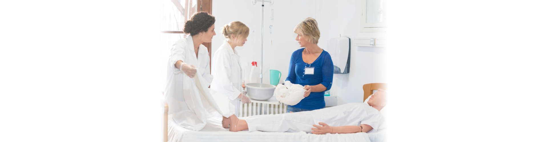 nurses having training with a registered nurse assisting them